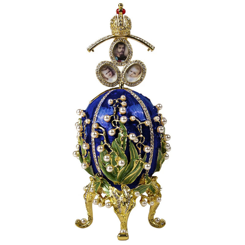Ornate blue egg-shaped trinket box with gold filigree, pearl beads, and floral accents