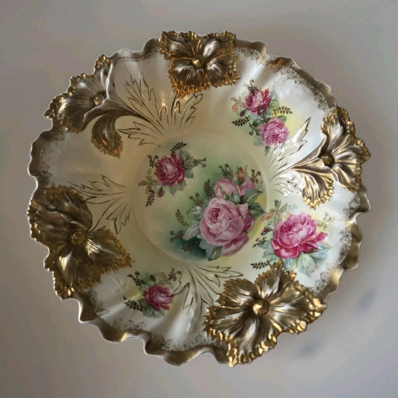 White porcelain decorative bowl with pink roses and ornate gold gilt edge