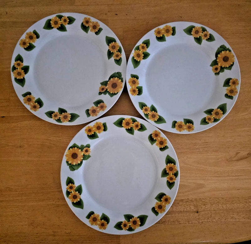 Set of three 7-inch salad plates with sunflower-daisy floral rim