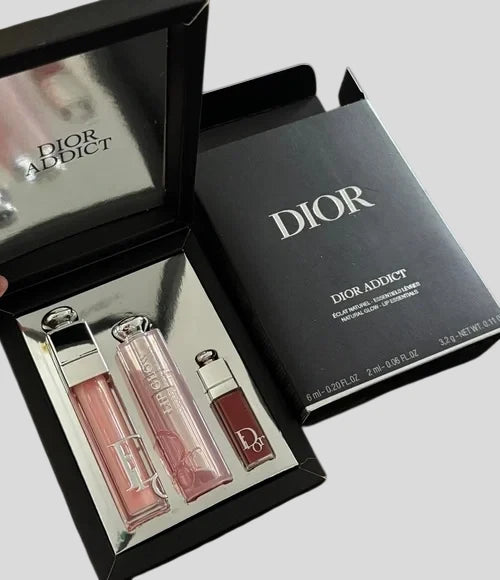 Dior Addict 3-piece lip gloss set in black gift box with three pink-toned tubes