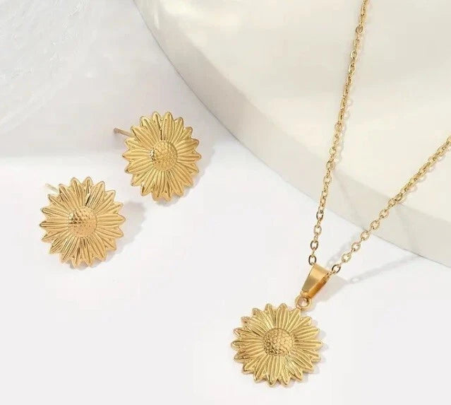 Gold sunflower stud earrings and matching necklace set in stainless steel.