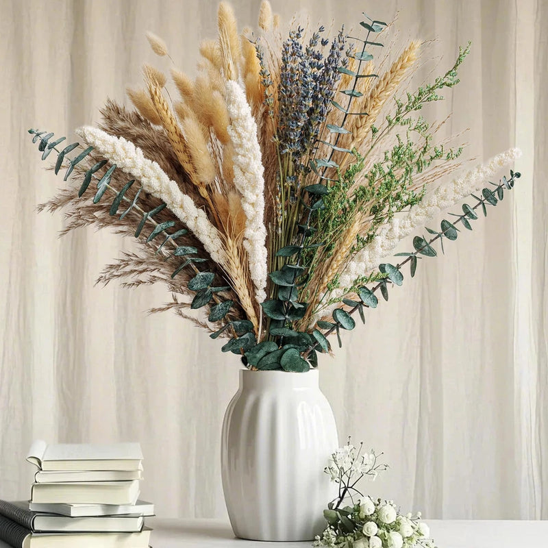 Boho dried flower bouquet with pampas grass, lavender and green stems in white vase