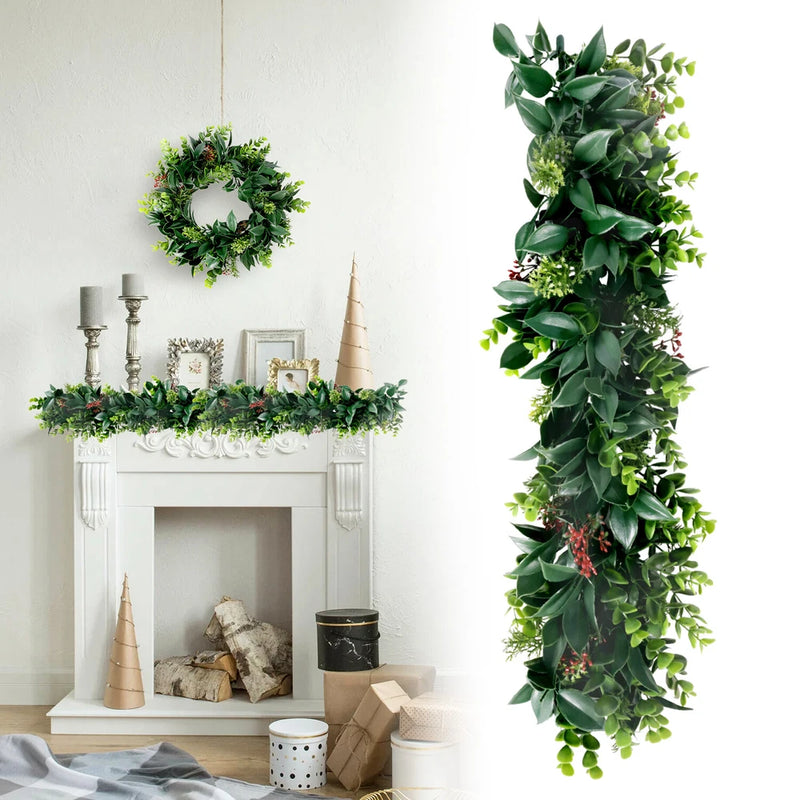 Artificial hanging ivy garland with glossy green leaves and small red accents, long vertical strand