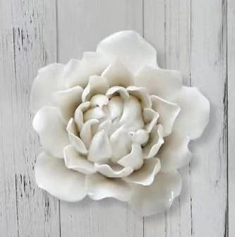 White ceramic peony flower ornament with layered petals.