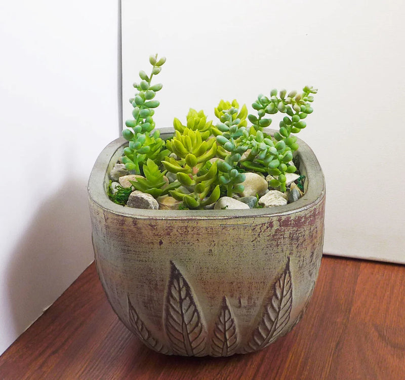 Artificial mini succulent plants in textured leaf-pattern pot