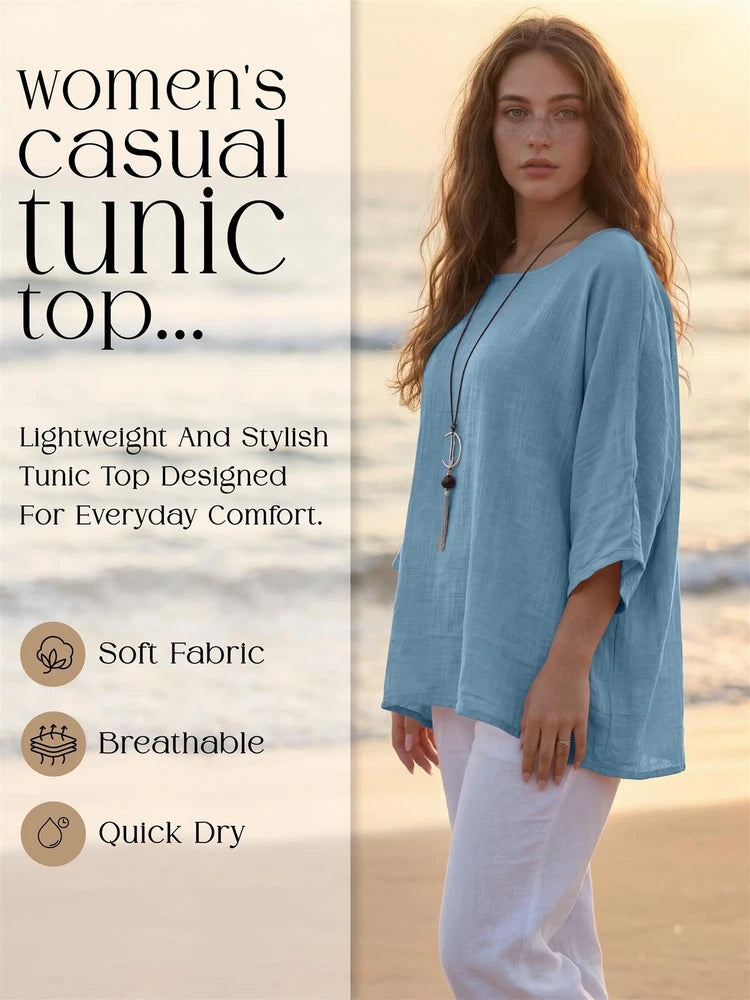 Light blue loose tunic top with 3/4 sleeves and long beaded necklace
