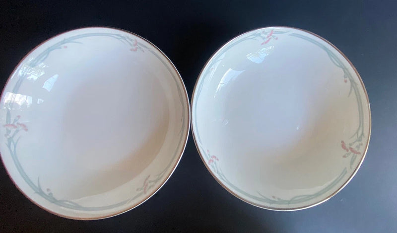 Pair of white soup bowls with delicate floral rim pattern