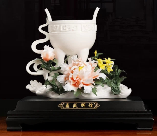 White porcelain peony incense burner with lid and floral relief, on dark base