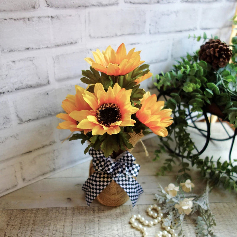 Black and white checked ribbon sunflower in small flower pot with bow