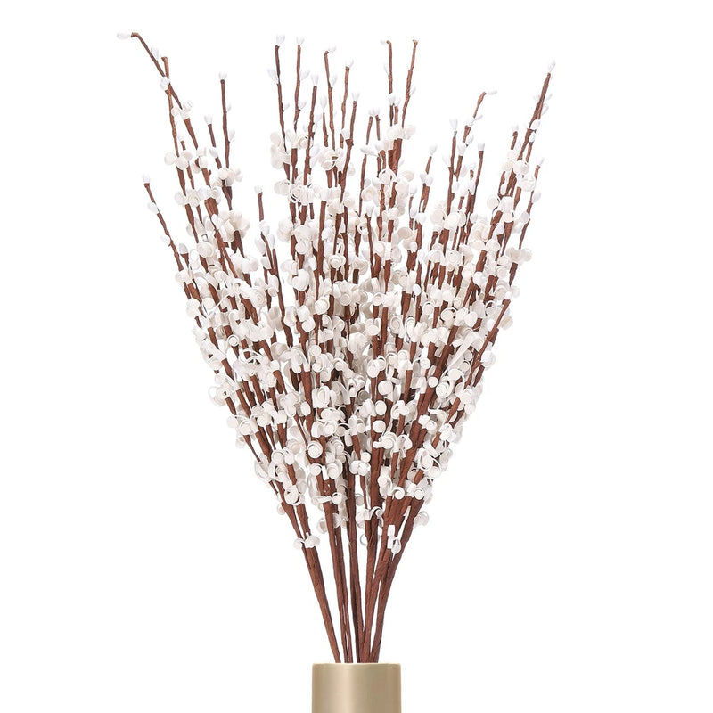 Tall DIY flower stems bundle with white jasmine blooms in tan vase