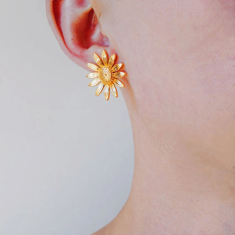 Gold-tone sunflower stud earring with jeweled center