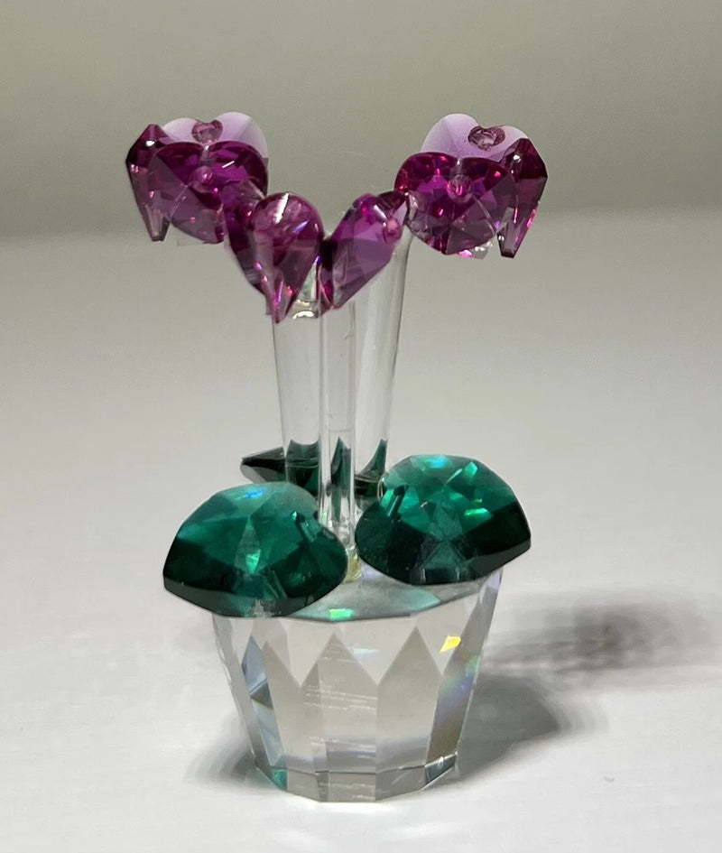 Faceted glass flower ornament figurine with purple crystal top and teal gem base