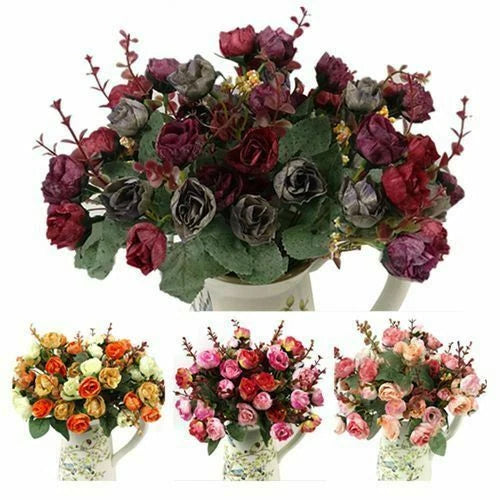 Artificial rose bouquet with burgundy and dark gray blossoms and small filler stems