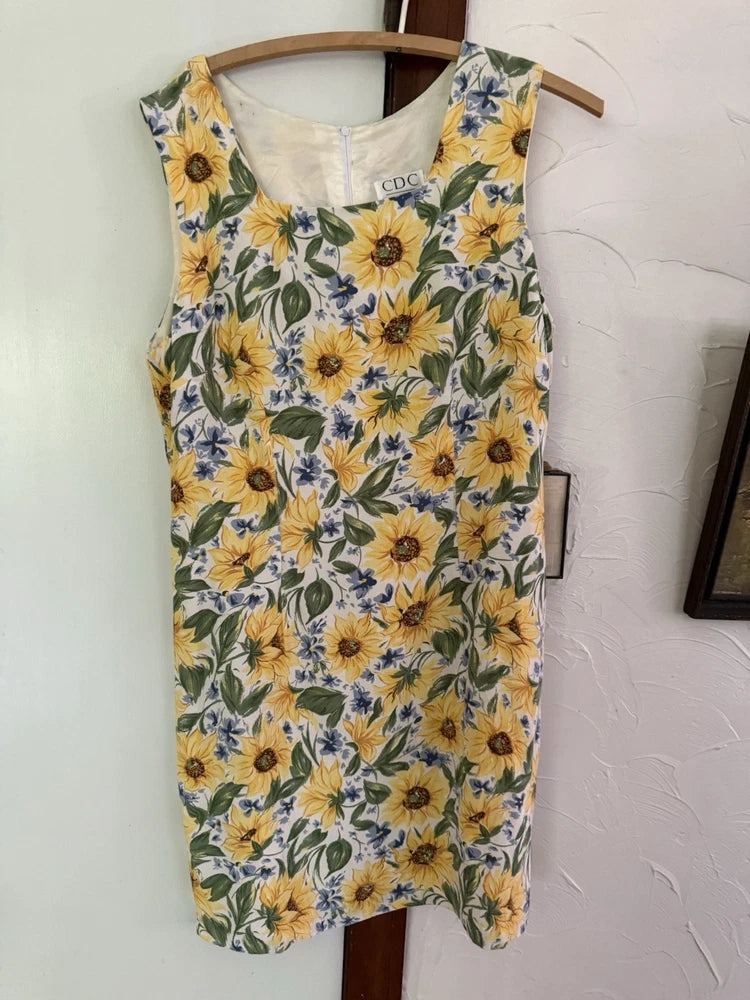 Women's sleeveless sunflower print dress, yellow with blue floral leaves