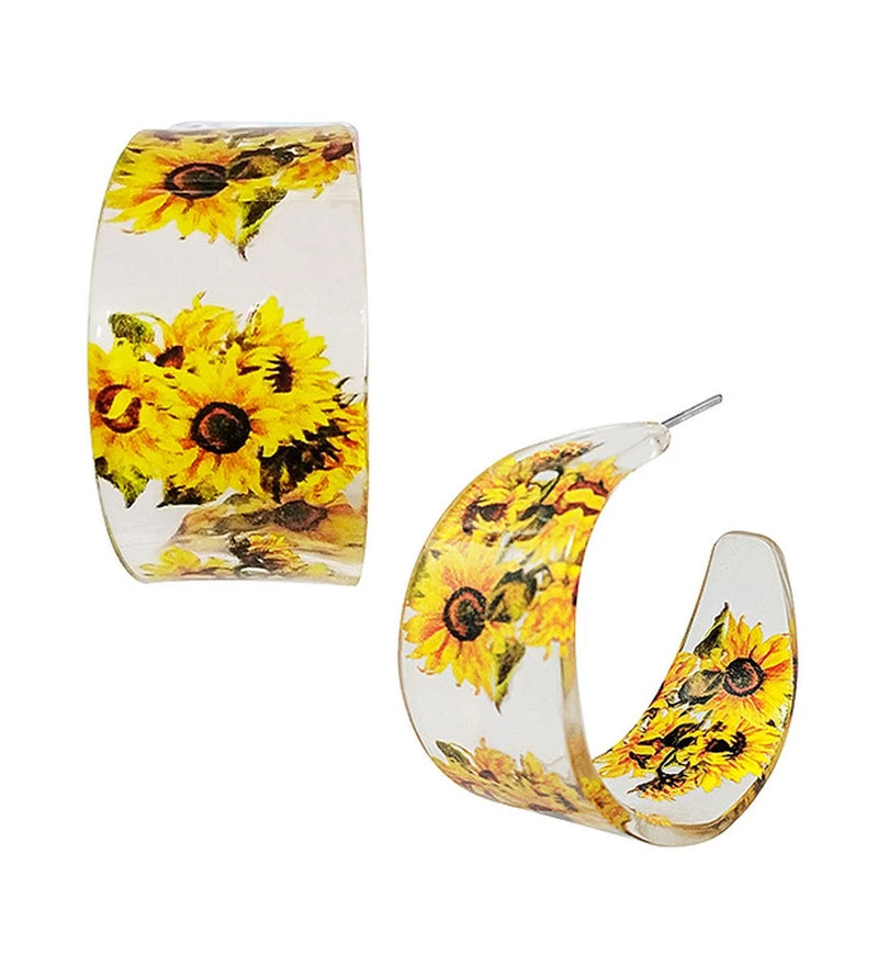 Transparent acrylic hoop earrings with yellow sunflower print and gold-toned hooks