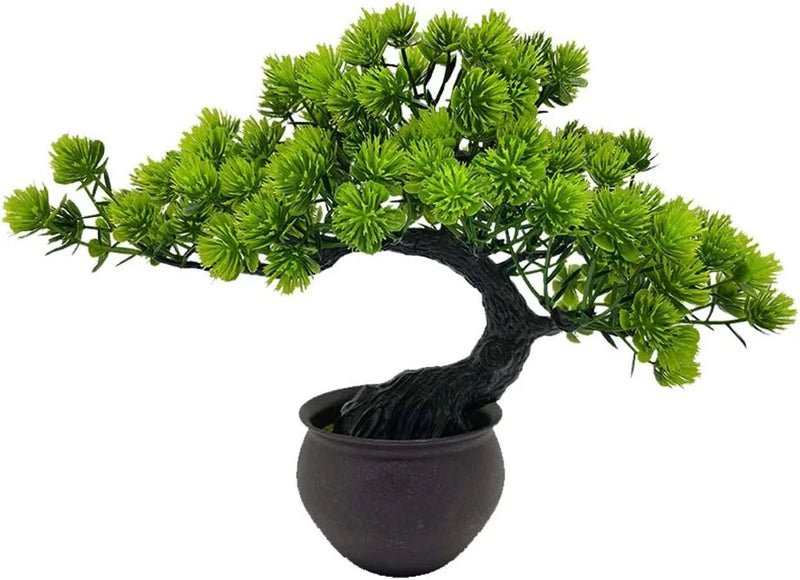 Artificial bonsai tree with green foliage in a black round pot