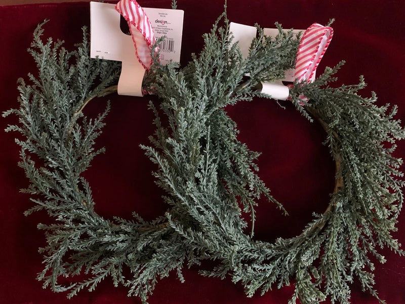 Artificial mini pine wreath with red-and-white striped ribbon loop