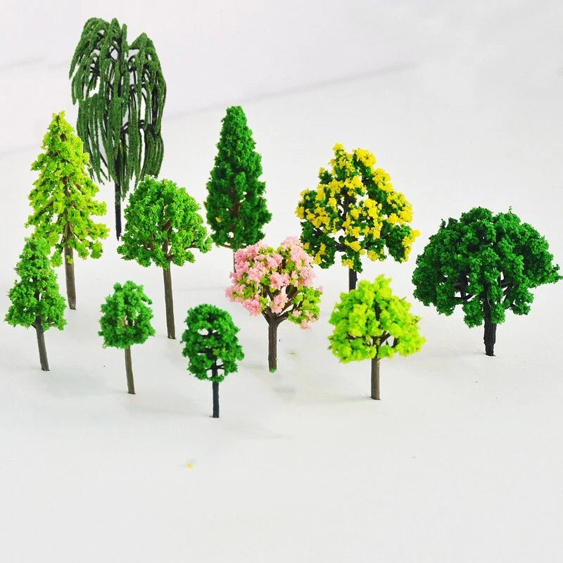 Set of 11 miniature fairy garden trees with green foliage, some with yellow and pink blossoms