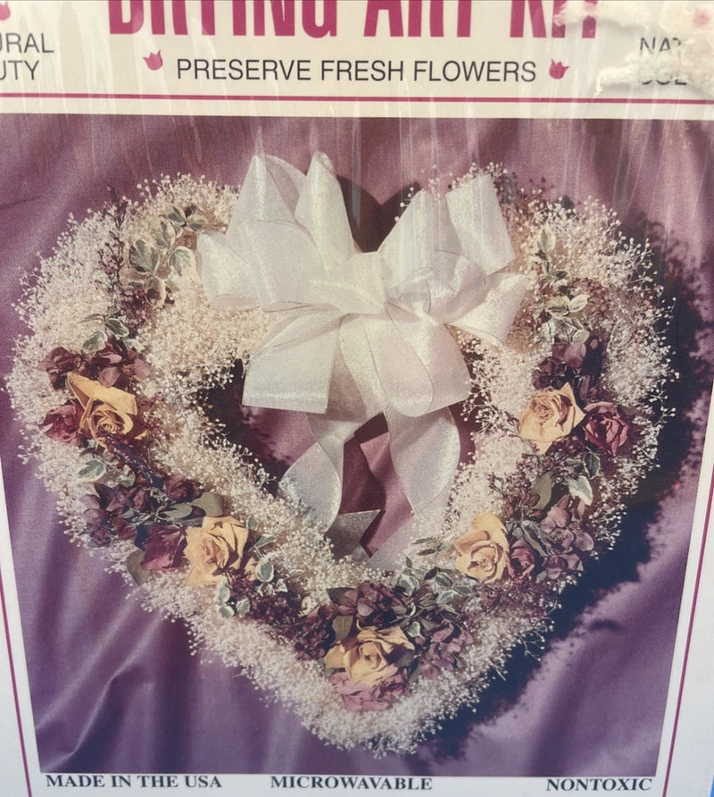 Flower drying art kit bag with heart-shaped wreath of dried flowers and white bow