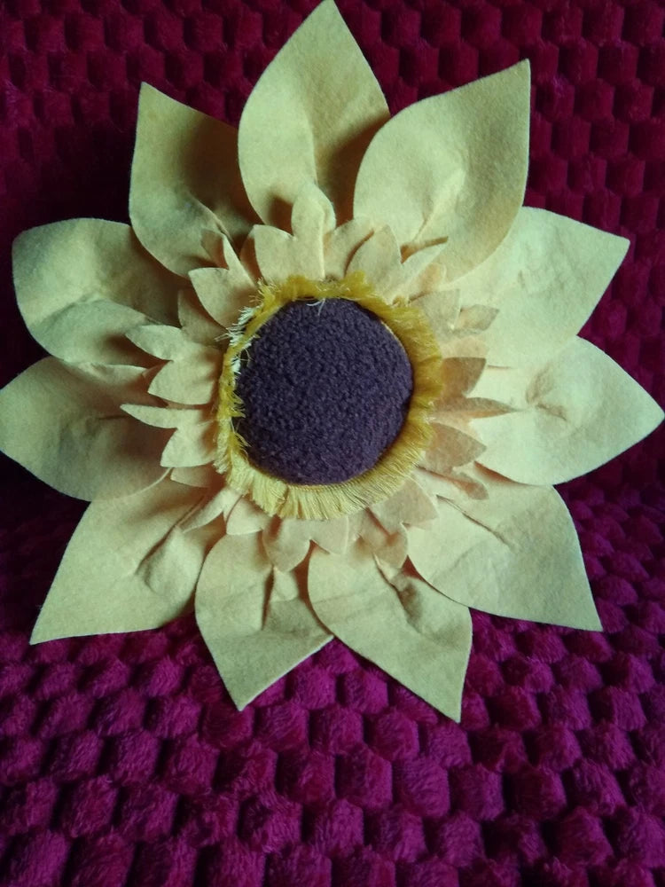 Sunflower decor pillow with 3-D fabric petals and dark center, round shape
