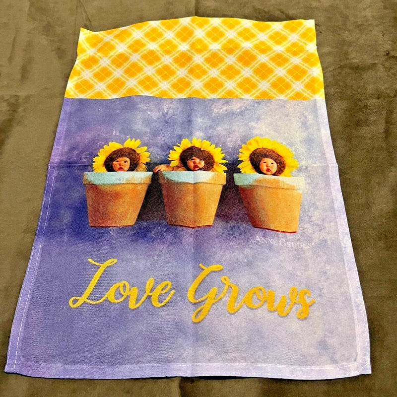Anne Geddes garden flag: 'Love Grows' with three sunflower baby faces in pots