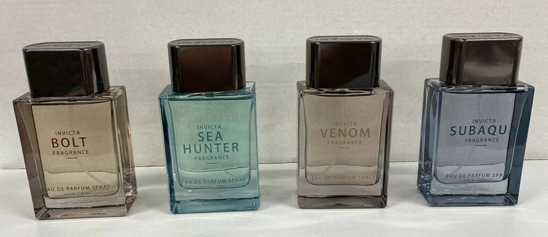 Men's eau de parfum spray bottles with dark square caps, four scents displayed
