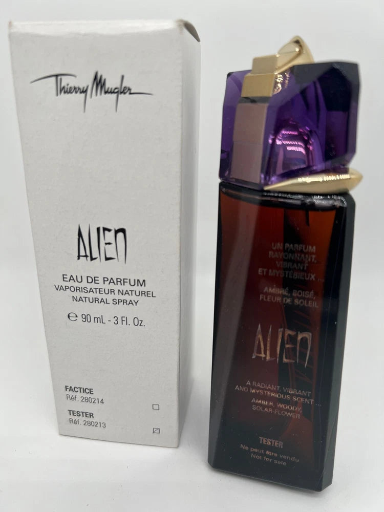 Alien Eau de Parfum tester bottle, dark glass with purple accents and gold cap