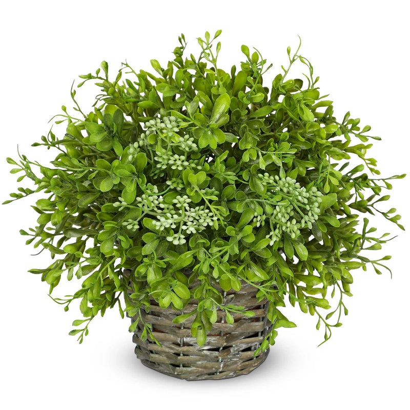 Artificial boxwood plant with dense green leaves in a gray woven basket pot