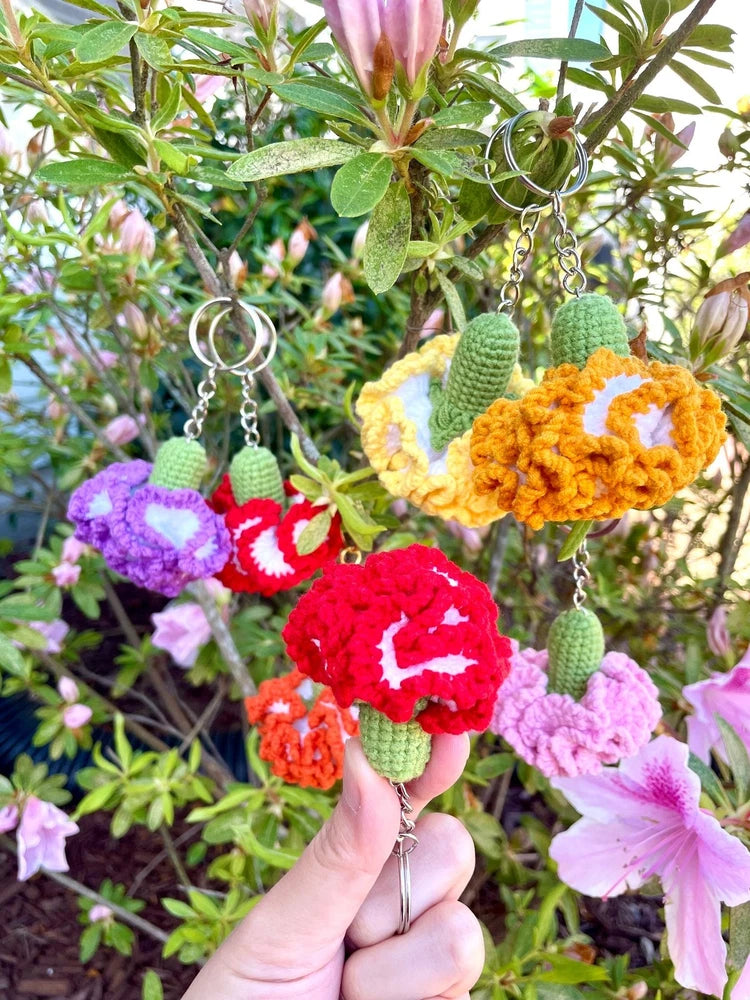 Crochet flower keychain bag charm with multiple colorful blossoms and metal rings