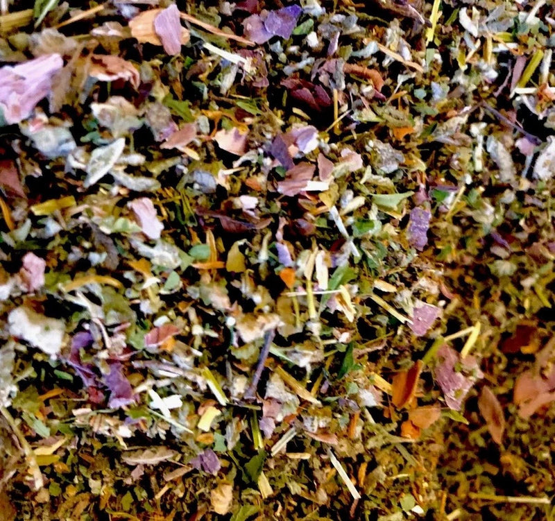 Dried herbal flower mix with pink, purple, green, and yellow petals and stems