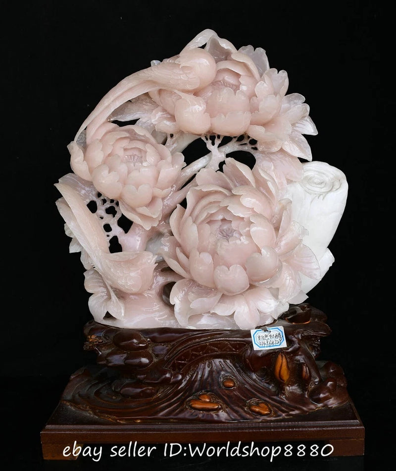 Pink carved jade peony flower and bird sculpture on dark wood base