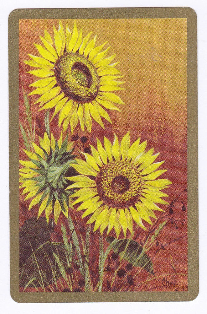 Sunflower playing card with three bright yellow flowers and dark centers