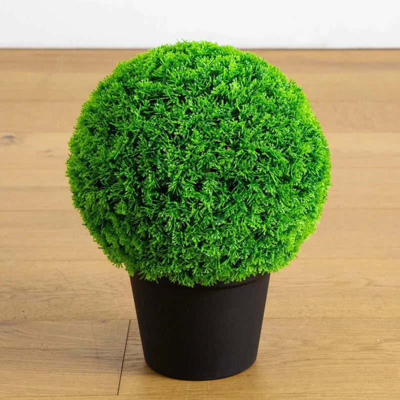Artificial cypress topiary plant in black round pot, dense bright green globe shape
