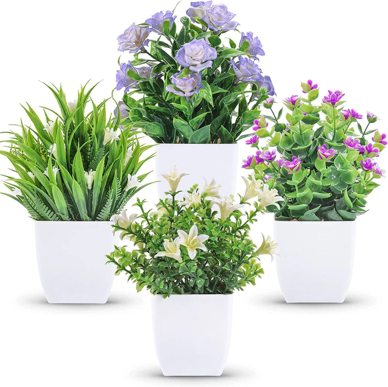 Set of 4 mini artificial faux plants with rose flowers, in white pots.