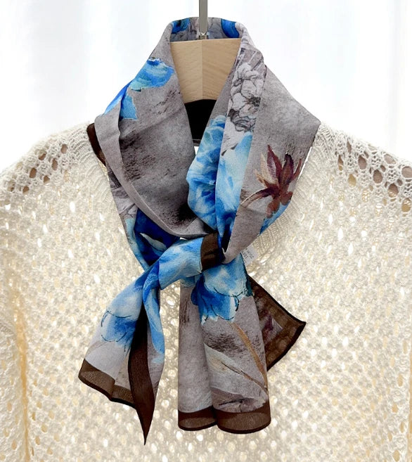 Floral print silk neckerchief scarf, blue and gray with brown trim, tied knot