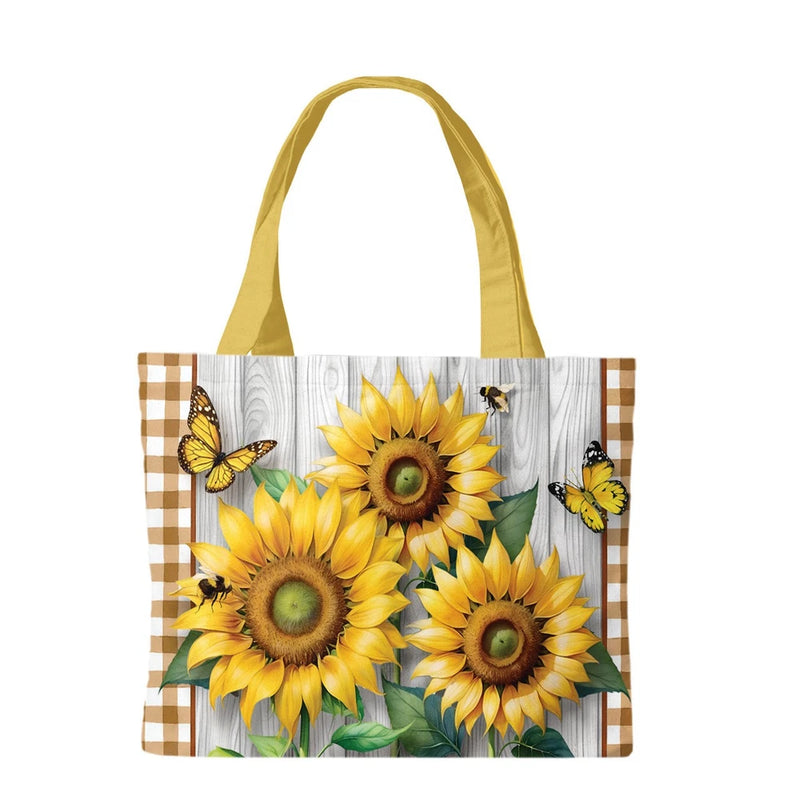 Canvas tote bag with large sunflower print, yellow handles and butterflies