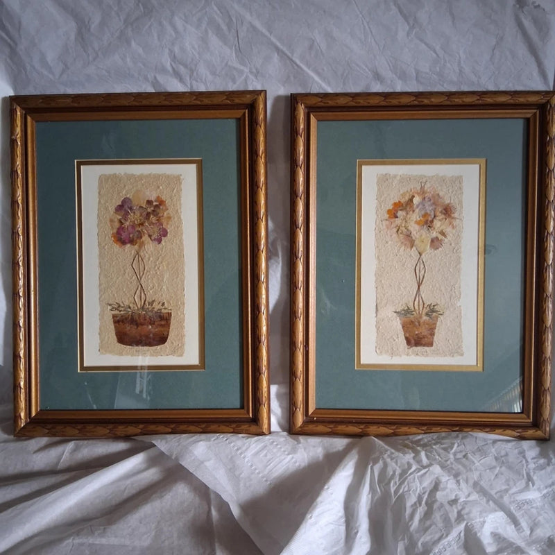 Pair of vintage framed pressed dried flower art prints, brown frames with floral stems