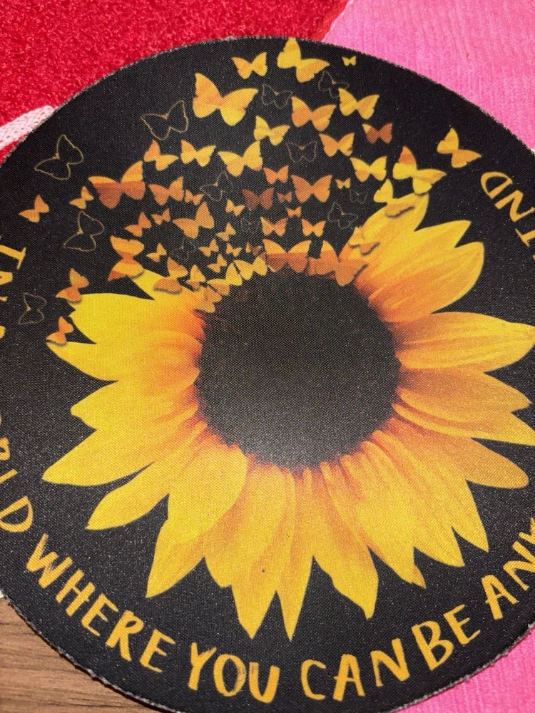 Sunflower mouse pad with butterfly print, round black base