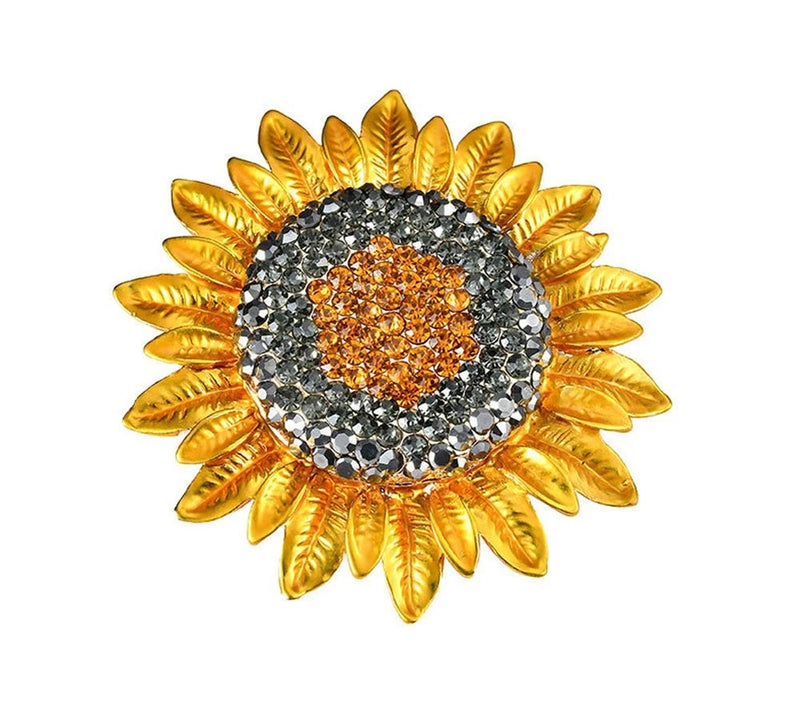 Gold sunflower brooch pin with rhinestone petals and orange center, circular crystal border