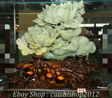 Green jade-style bird and peony flower carving statue on detailed dark base