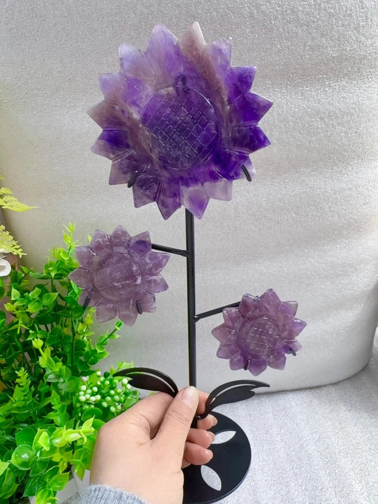 Amethyst purple crystal sunflower flowers on black metal stand, three carved blooms