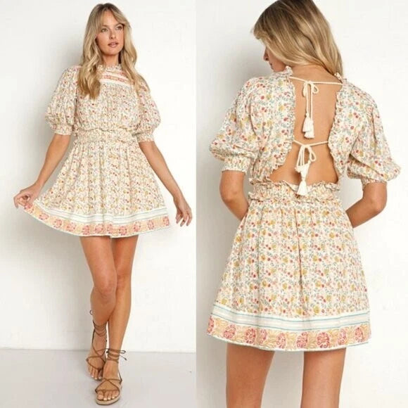 Floral mini dress with puff sleeves, high neck, open back ties, cream border trim