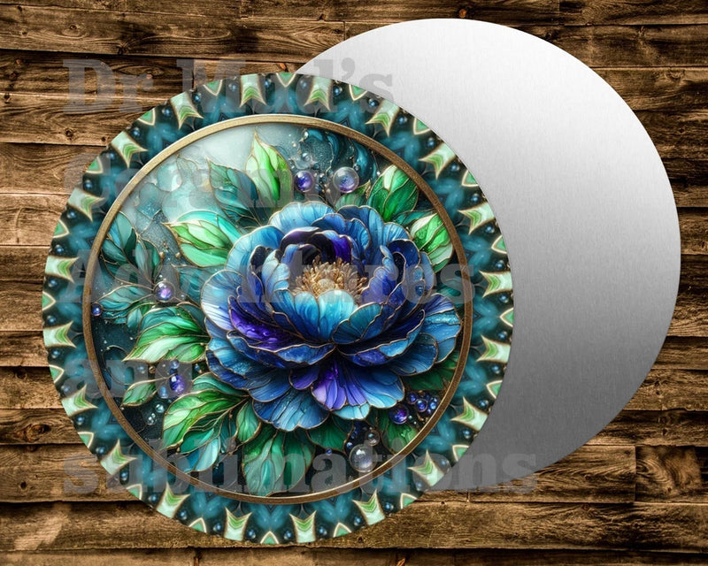 Round metal sign with blue peony floral center and teal-green decorative border