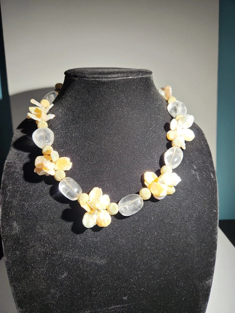 Flower pendant necklace with white and yellow blossoms, clear and silver bead accents