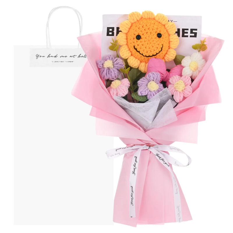 Pink crochet sunflower bouquet with crocheted flowers, wrapped with a bow and gift bag