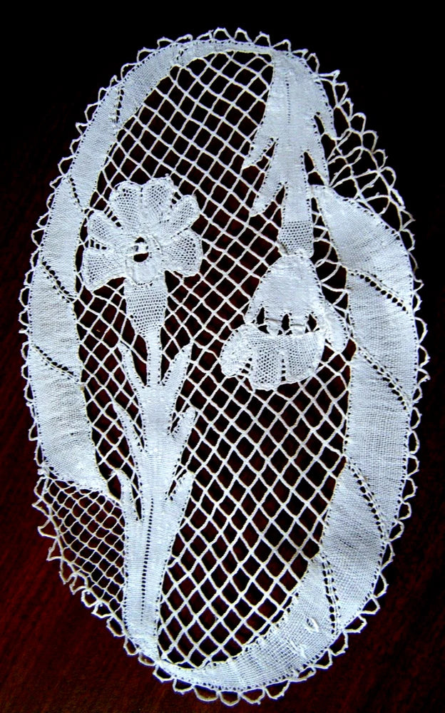 Oval Italian lace doily with floral carnation needlework