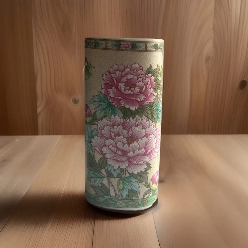 Pink porcelain oval vase with large peony-style floral print and green leaves