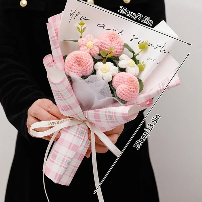 Crochet artificial flower bouquet wrapped with pink plaid ribbon, pink and white blooms