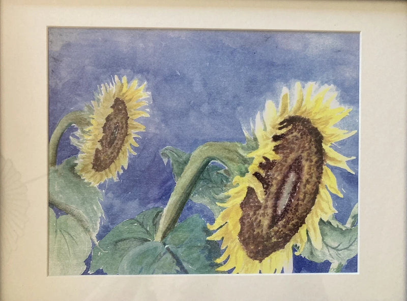 Matted sunflower watercolor print with two yellow blooms and green leaves, blue background