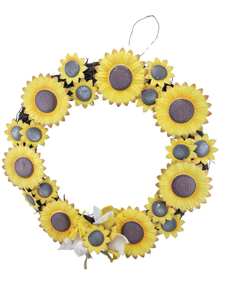 Artificial sunflower wreath with yellow metal flower heads and dark centers, round wall decor